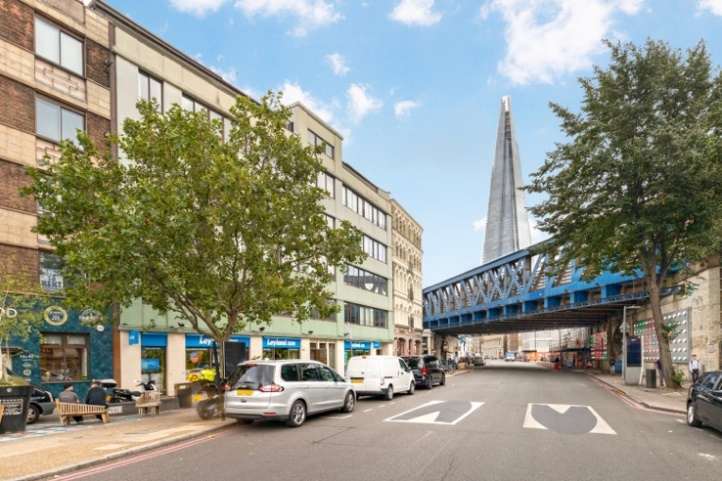 Southwark Street looking towards the railway bridge with The Shard behind